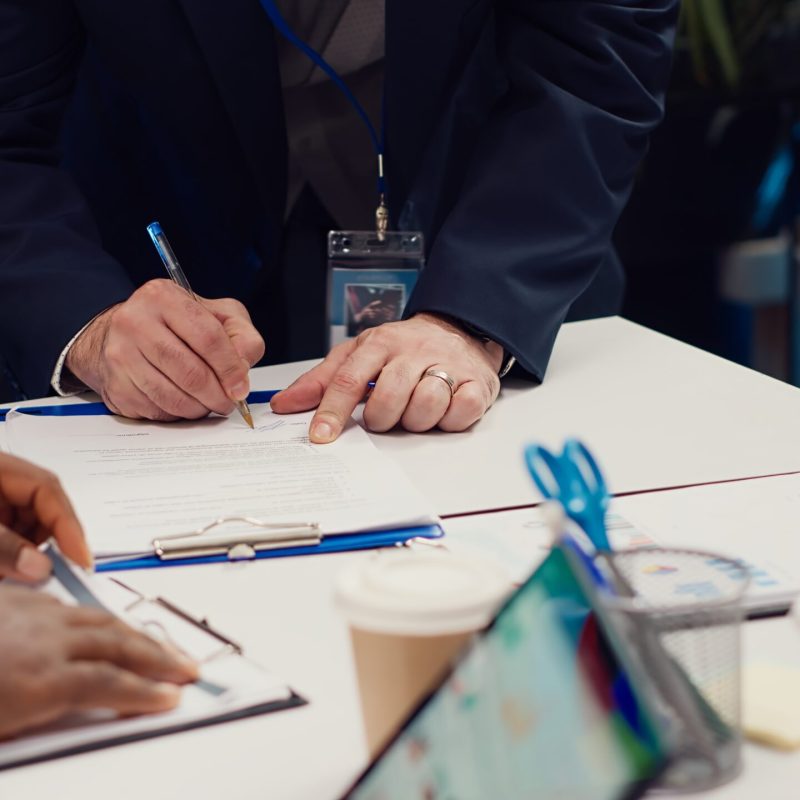 Entrepreneurs signing a new partnership contract between their firms, joining forces to capitalize on synergies. Managers collaborate to resolve specific skill gaps and development needs. Camera A.